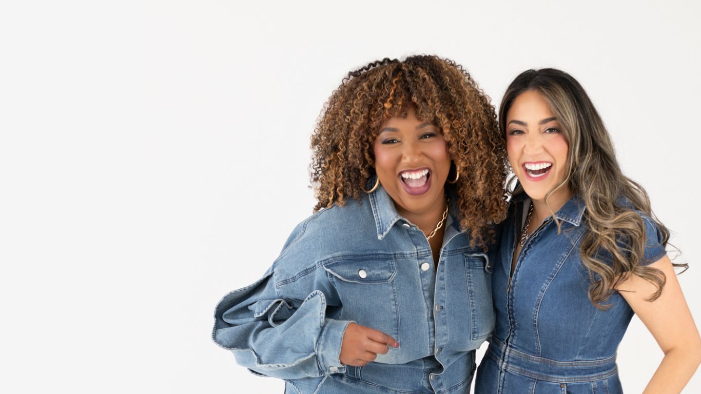 Kisha and Shana from The Exit Interview On Air Podcast wearing denim and laughing together